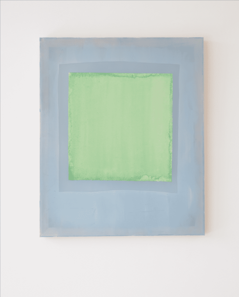 Composition of lemon green coloured paper on indigo blue